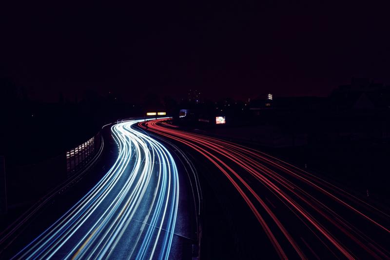 Lights of cars at night on a highway