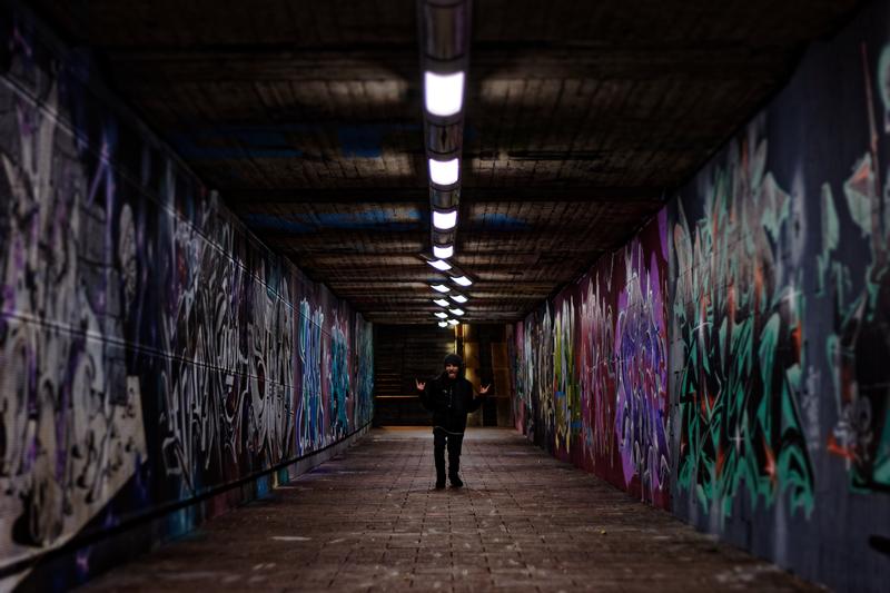Man standing in underground tunnel