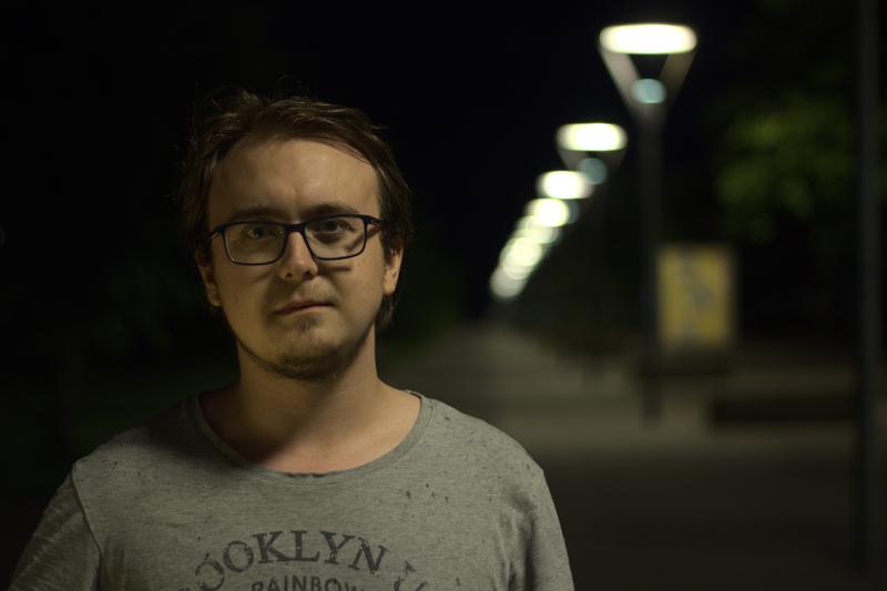 Man standing in front of some lights